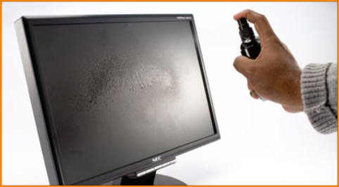 Spraying Cleaner onto LCD Screen